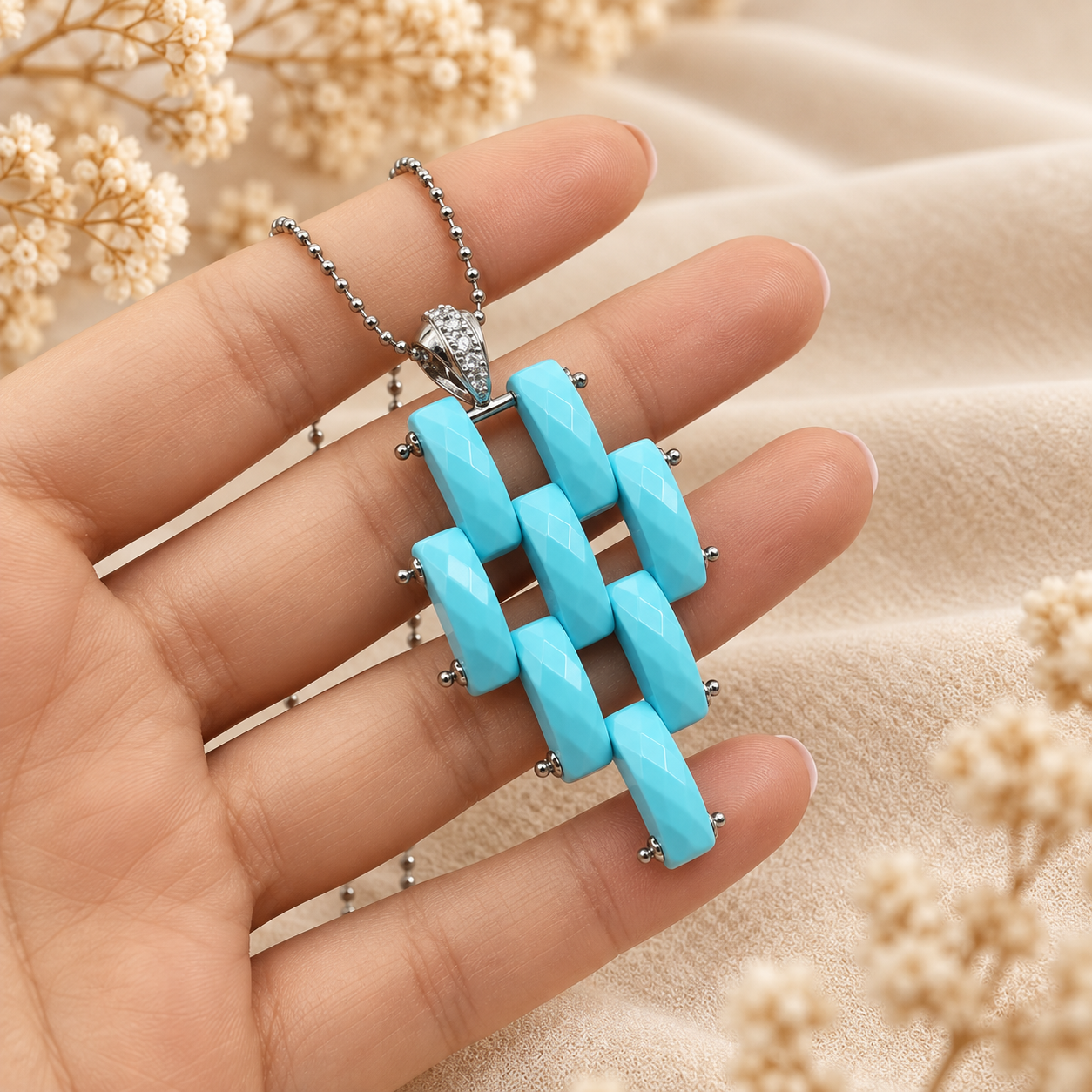 Collana Corda con Pendente Modello Cartier di Pasta Turchese 4 Fiori in Argento 925 Rodiato e Zirconi