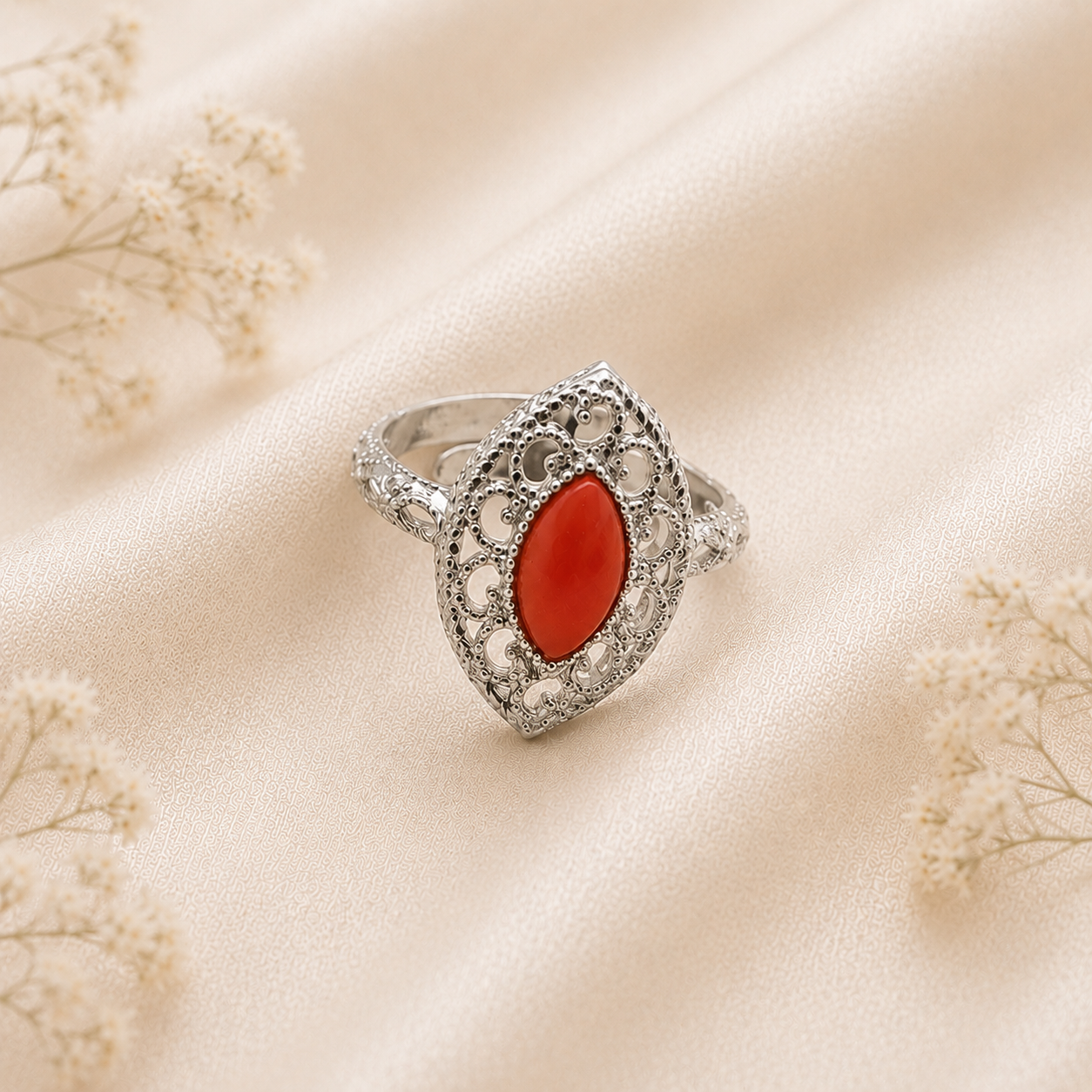 Anello Imperial in Argento 925 rodiato con cabochon a navetta di Corallo Rosso Naturale del Mediterraneo e raffinata lavorazione traforata.