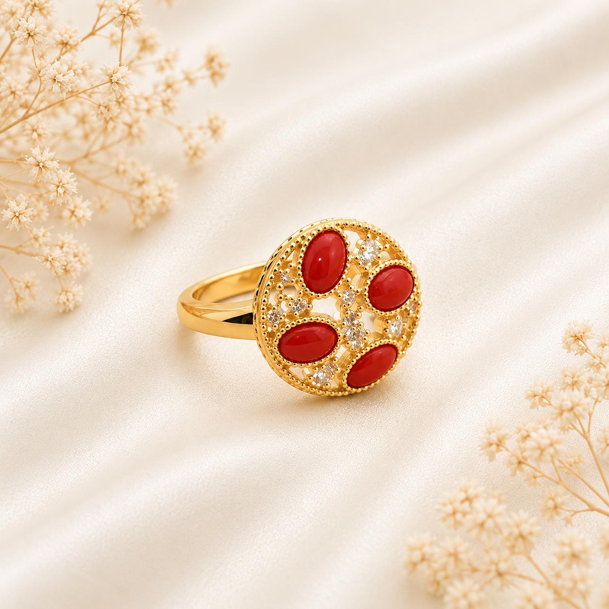 Anello Splendid in Argento 925 placcato oro con quattro cabochon di Corallo Rosso Naturale del Mediterraneo, zirconi e misura regolabile.